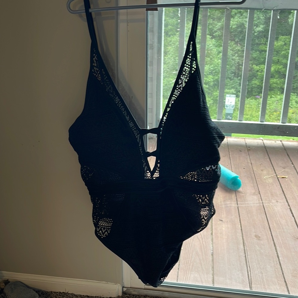 Cute 1 piece bathing suit. Never worn